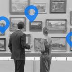 Caucasian couple in evening wear admiring art in museum